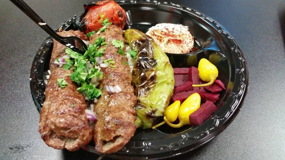 Beef Lule Kabob Plate · Seasoned ground beef. Served with hummus, grilled green pepper and tomato, choice of rice or french fries and pita bread or lavash bread. 