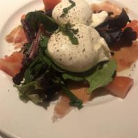 Burrata · Served on thinly sliced prosciutto, ripe tomatoes, basil, extra virgin olive oil, balsamic g...