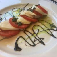 Mozzarella Caprese · Served with vine ripe tomatoes; extra virgin olive oil and balsamic glaze.
