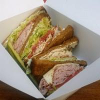 Turkey Club Sandwich · Triple decker turkey, ham, bacon and American cheese with mayo, lettuce and tomato.