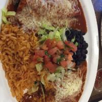 Rudys Spinach Enchiladas · Baby spinach sauteed with olive oil, garlic and sweet corn. Topped with red sauce and cheese.