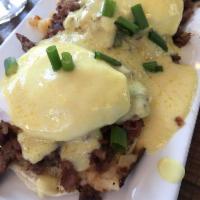 Irish Benny · 2 poached eggs and our house-made corned beef hash on an English muffin topped with holly sa...