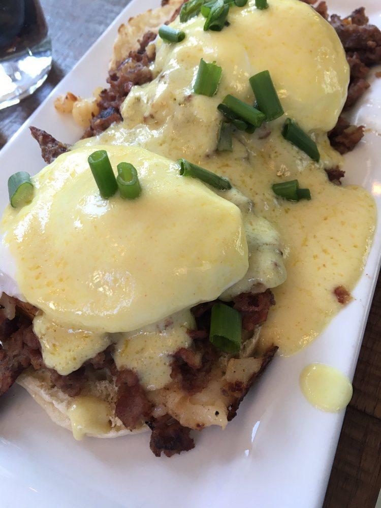 Irish Benny · 2 poached eggs and our house-made corned beef hash on an English muffin topped with holly sauce.