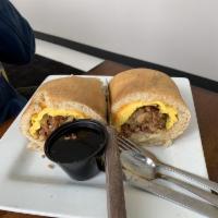 Our Signature Big Daddy Pancake Wrap · Scrambled eggs, homies, sausage, bacon and cheddar cheese wrapped into a
large buttermilk pa...