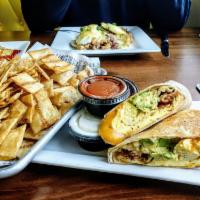 Spicy Avocado Bacon Wrap · Scrambled eggs, bacon, avocado, chipotle ranch and cheddar cheese wrapped into a large torti...