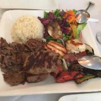 Doner Kebab · Vertically grilled lamb sliced very thin and served over rice and salad. 