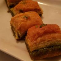 Baklava · Sweet dessert pastry made of layers of filo filled with chopped ground nuts and sweetened an...