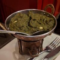 Palak Paneer · Blend of fresh spinach, ginger, onion and cubes of homemade cottage cheese cooked in light s...
