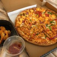 Shahi Paneer Pizza · Shahi paneer sauce, shredded mozzarella cheese, sliced red onions, sliced green pepper, slic...