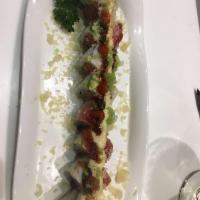 Angel Roll · Spicy tuna, topped with tuna, shrimp, avocado, tempura flakes and wasabi tobiko.