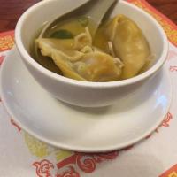 Wonton Soup · Seasend broth with filled wonton dumplings.