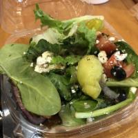 Greek Salad · Lettuce, tomatoes, cucumbers, red onions, feta cheese, Kalamata olives and Greek dressing.