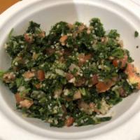 Tabouleh Salad · Chopped fresh parsley, diced tomatoes, diced onions, fresh mint, bulgur wheat, lemon juice a...