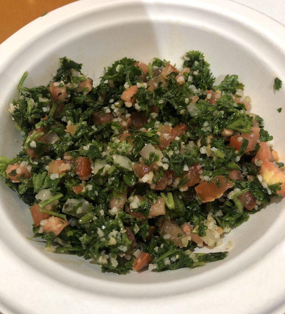 Tabouleh Salad · Chopped fresh parsley, diced tomatoes, diced onions, fresh mint, bulgur wheat, lemon juice and olive oil.