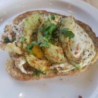 Avocado Toast · Locally baked brioche bread, avocado, fried egg, sea salt, tajin and cilantro
