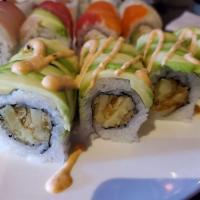 Dragon Roll · Shrimp tempura, avocado, cooked eel, flying fish eggs, sushi rice, unagi sauce, paper.