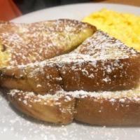 French Toast · Topped with  powdered sugar and cinnamon.