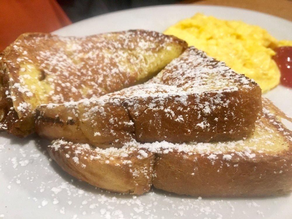 French Toast · Topped with  powdered sugar and cinnamon.