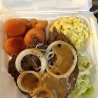 Liver and Onions · Tender slice of grilled liver, crowned with sauteed onions and smothered in gravy.