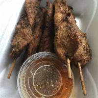 Chicken Satay · Chicken on stick ruminated in yellow curry. Served with peanut sauce on the side. 6 per serv...