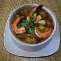 Tom Yum Soup · Flavored lemongrass soup with Shrimp, galangal, kaffir lime leaves, straw mushroom.