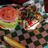 Tuscan Chicken Sandwich · Juicy grilled chicken breast topped with mozzarella cheese, basil, roasted red peppers and d...