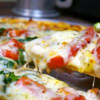 Veggie Monster Pizza ·  spinach, mushrooms, tomatoes, red onion and roasted red peppers with our red sauce. Vegetar...