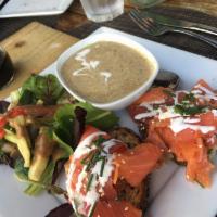 Smoked Salmon Tartine Sandwich · Served with creme fraiche, chives, avocado, and sesame seeds. Served with your choice of fre...