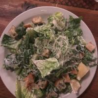 Caesar Salad · Hearts of romaine, Parmesan cheese, house-made croutons.