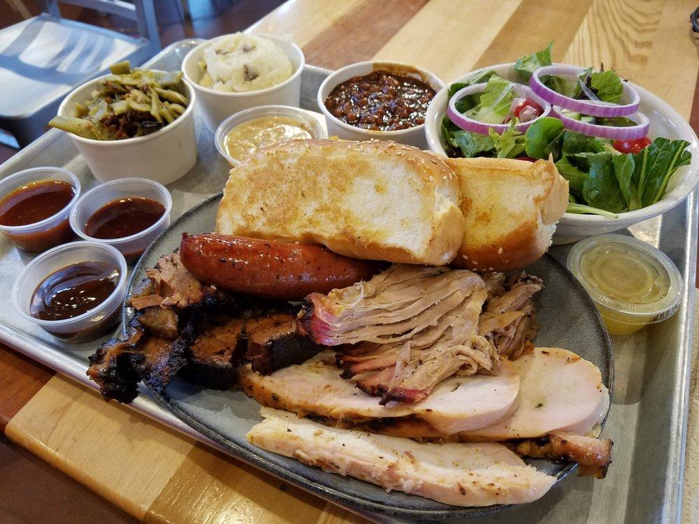 Pulled Pork · Hand-rubbed, smoked over local hickory wood, and pulled to order