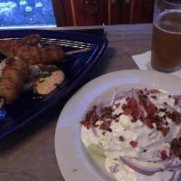 Wedge Salad · Iceberg lettuce, tomatoes, smoked bacon, red onion, and bleu cheese dressing. Vegetarian and...