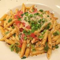 Cajun Chicken Penne · Blackened chicken, bell peppers, shallots, tomatoes, garlic, scallions, Parmesan, and spicy ...
