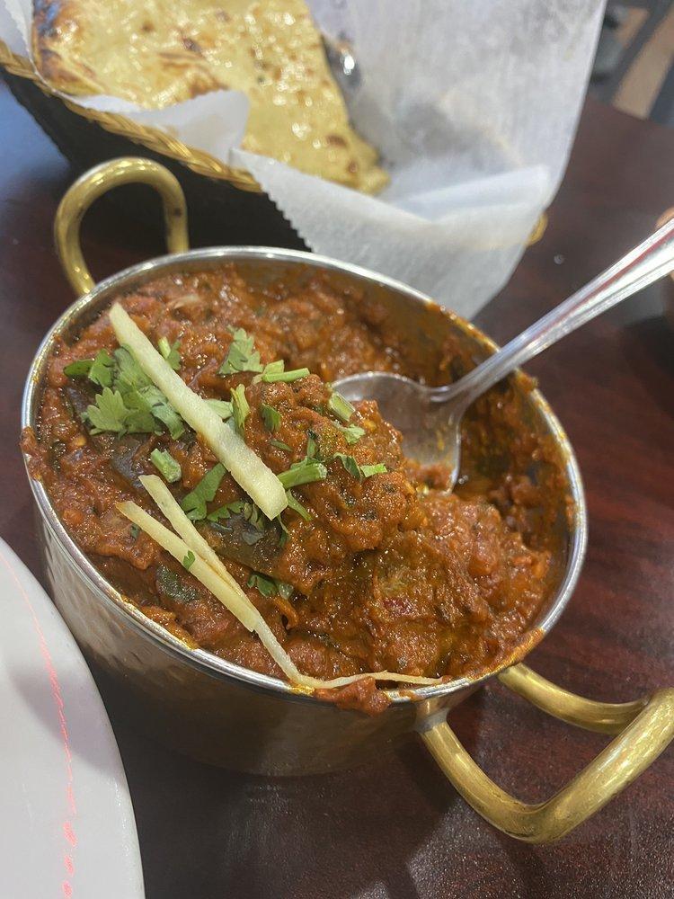 Lamb Vindaloo · A very hot lamb curry cooked with dry red chilies, vinegar, potatoes.