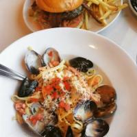 Northwest Seafood Fettuccine · Bay shrimp, prawns, clams, mussels, salmon, and cod in parmesan-garlic cream.

