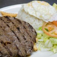 Churrasco · Charbroiled beef served with french fries, rice, fried egg, avocado and salad.