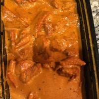Butter Chicken · Marinated chicken cooked in tomato curry sauce and Indian spices. Also known as Chicken makh...