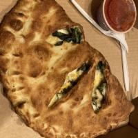 Calzone · A generously portioned pocket pizza filled with ricotta, house blend cheese and your choice ...