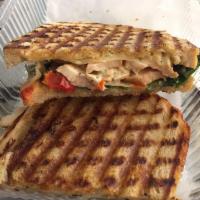 Chicken Pomodori Panini · Grilled chicken, provolone, basil, spinach, oven-roasted tomato, pesto* aioli, grilled sourd...