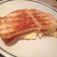 Bacon & Cheddar Panini · Scrambled eggs, bacon, cheddar, grilled sourdough.