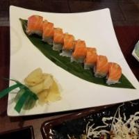 Lemon Roll · Spicy tuna, crab meat, cucumber topped with fresh salmon and sliced lemon.