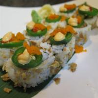 Southwestern Roll · Spicy salmon, cucumber and crunch batter topped with fresh slices of jalapeno and smelt roe.