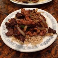 Mongolian Beef · Sliced beef marinated with green onions in mongolian sauce. Served with fried rice or steame...