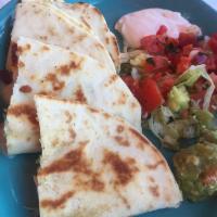 Chicken Quesadillas · Homemade flour tortillas filled with chicken, Monterey jack cheese, green chiles, onions ＆ c...