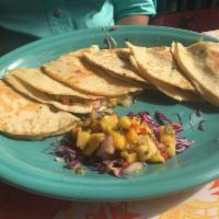 Shrimp Quesadillas · Homemade flour tortillas filled with shrimp, Monterey jack cheese, green chiles, onions, cil...
