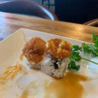 Popcorn Shrimp Volcano Roll · California roll, snow crab mix, cucumber, avocado, topped with popcorn shrimp and tossed wit...