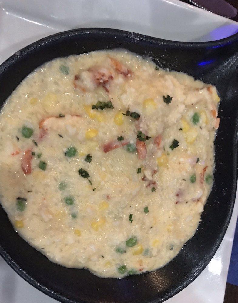 Lobster Risotto · Maine lobster, peas, corn tossed with our house-made risotto; finished with truffle oil.