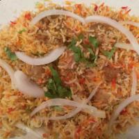 Chicken Biryani · Basmati rice cooked with boneless chicken with blend of Pakistani herbs, yogurt and spices.