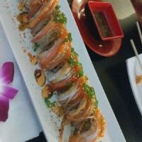 Spicy Cowboy Roll · Cucumbers, tempura shrimp on the inside. Crab, spicy mayo, masago, eel sauce, wasabi mayo, g...