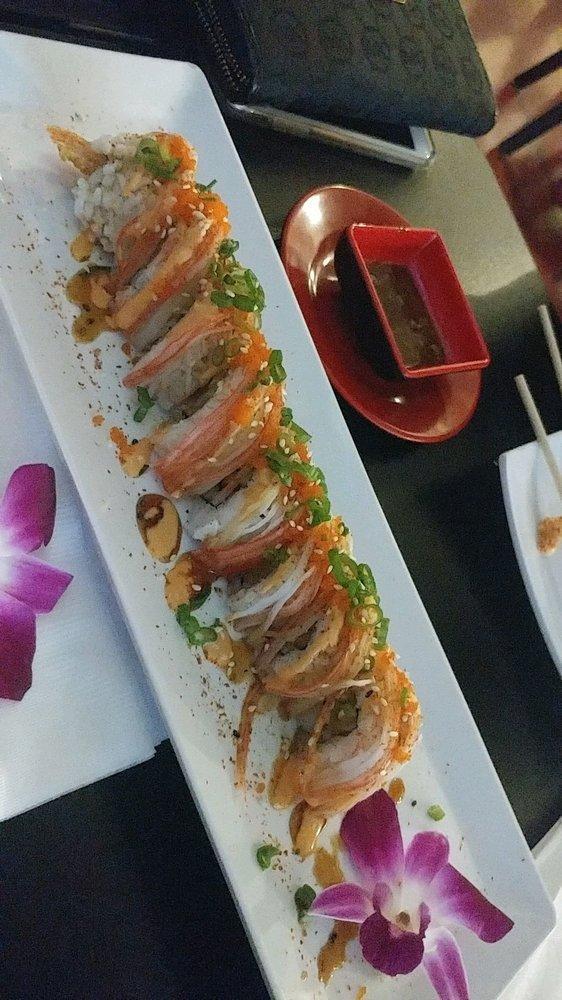 Spicy Cowboy Roll · Cucumbers, tempura shrimp on the inside. Crab, spicy mayo, masago, eel sauce, wasabi mayo, green onion on the outside.