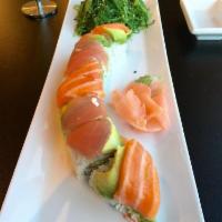 Rainbow Roll · Crab, avocado, cucumber on the inside and avocado and chef's choice of fish on the outside.